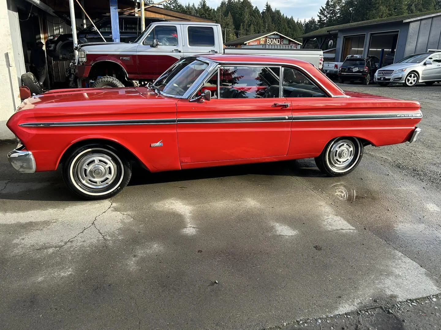 Red classic Ford photographed in profile