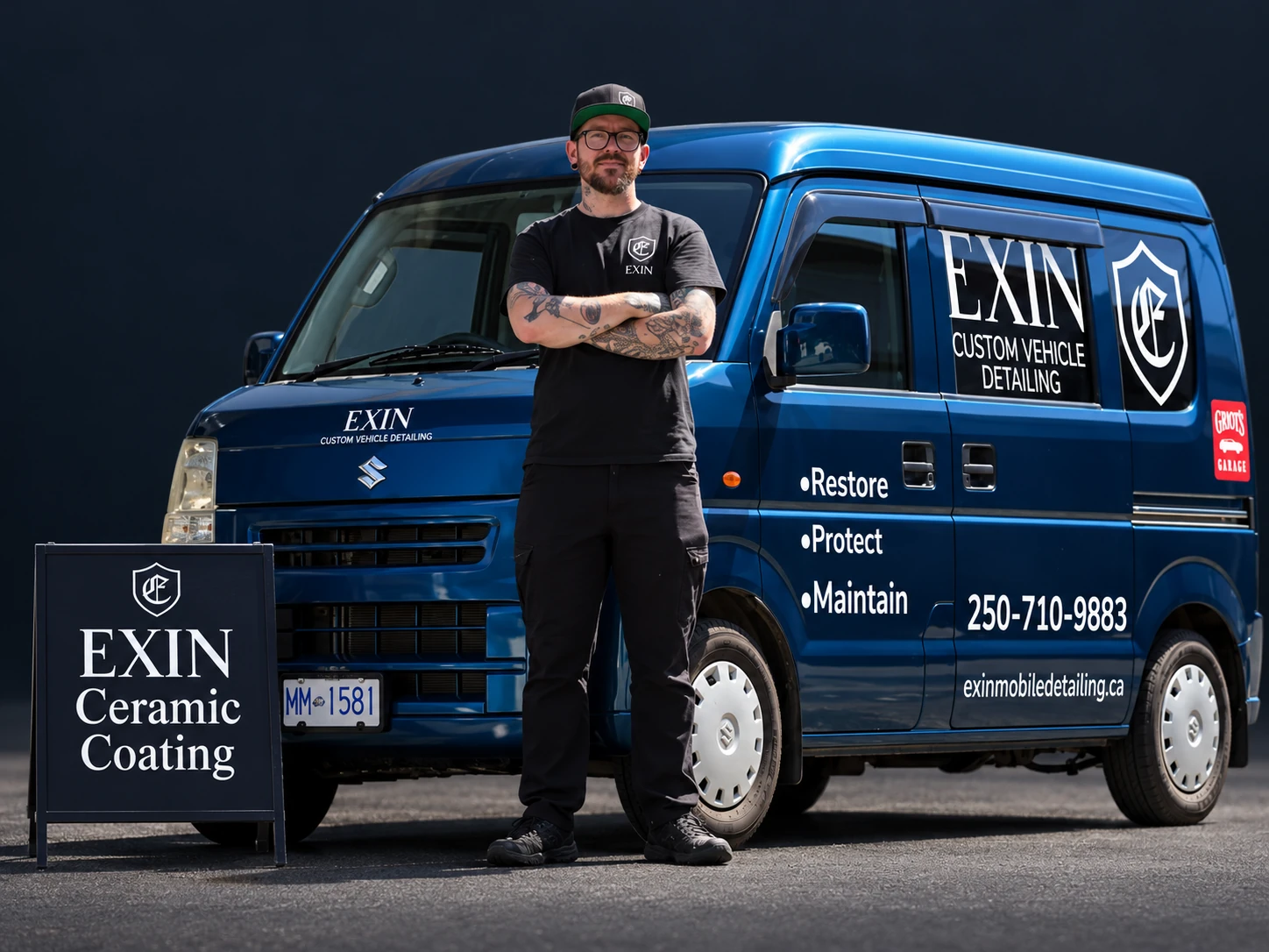 Jamie standing in front of his EXIN van beside an EXIN Ceramic Coating sign