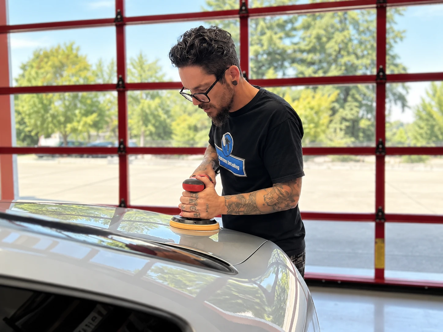 Jamie carefully polishing paintwork